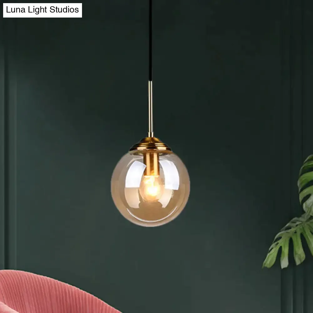 Sleek Brass Pendant Lamp with Amber/Smoke Glass Shade – Perfect for Dining Room Ceilings