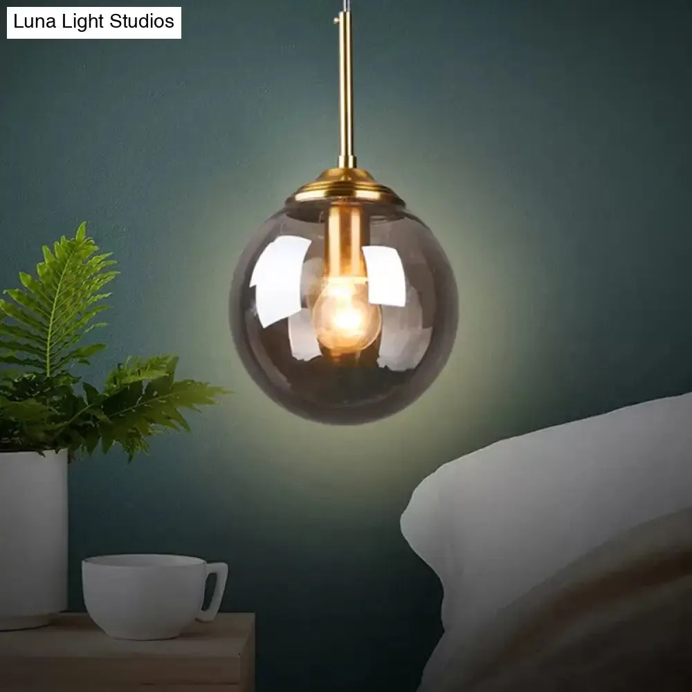 Sleek Brass Pendant Lamp with Amber/Smoke Glass Shade – Perfect for Dining Room Ceilings